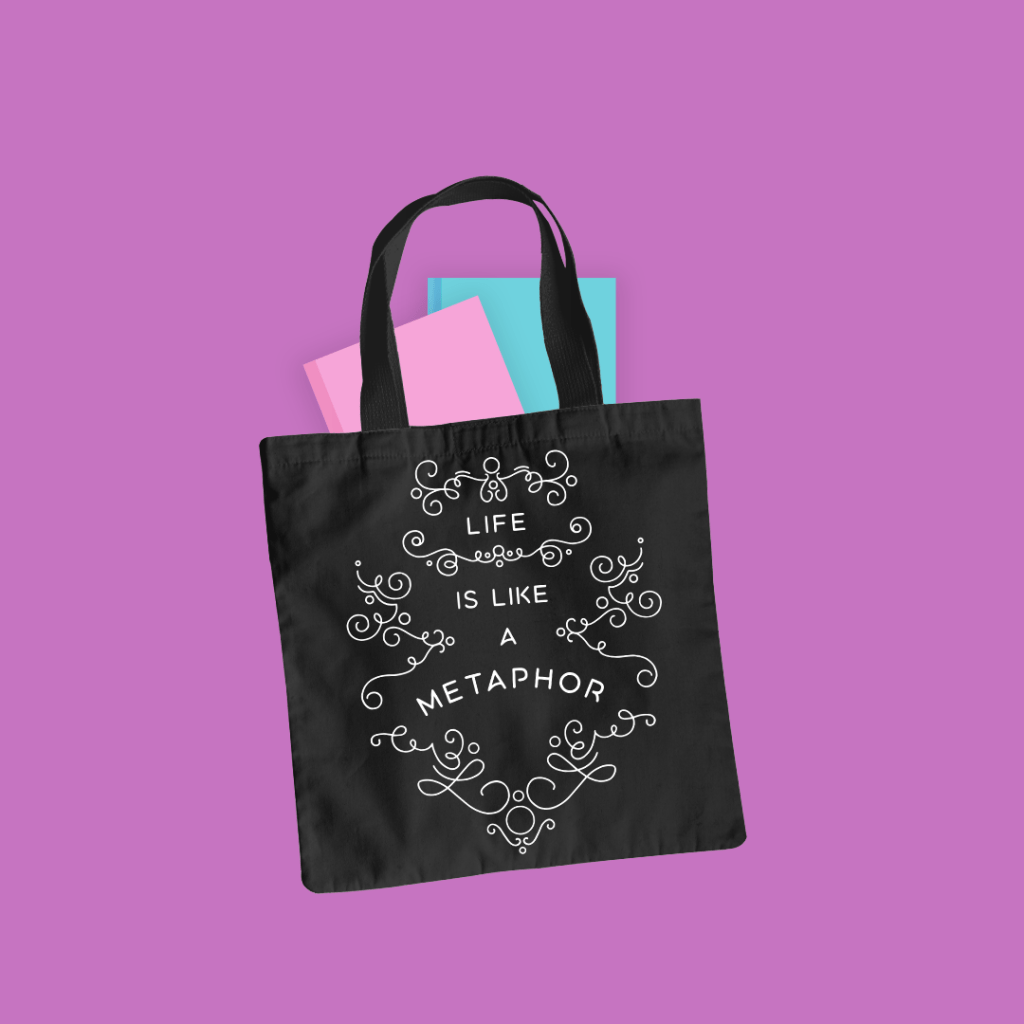 Mockup of a tote bag featuring the "Life is Like a Metaphor" design from BumbleBess.com.